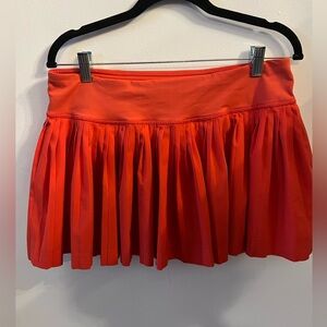 Lululemon orange tennis skort.